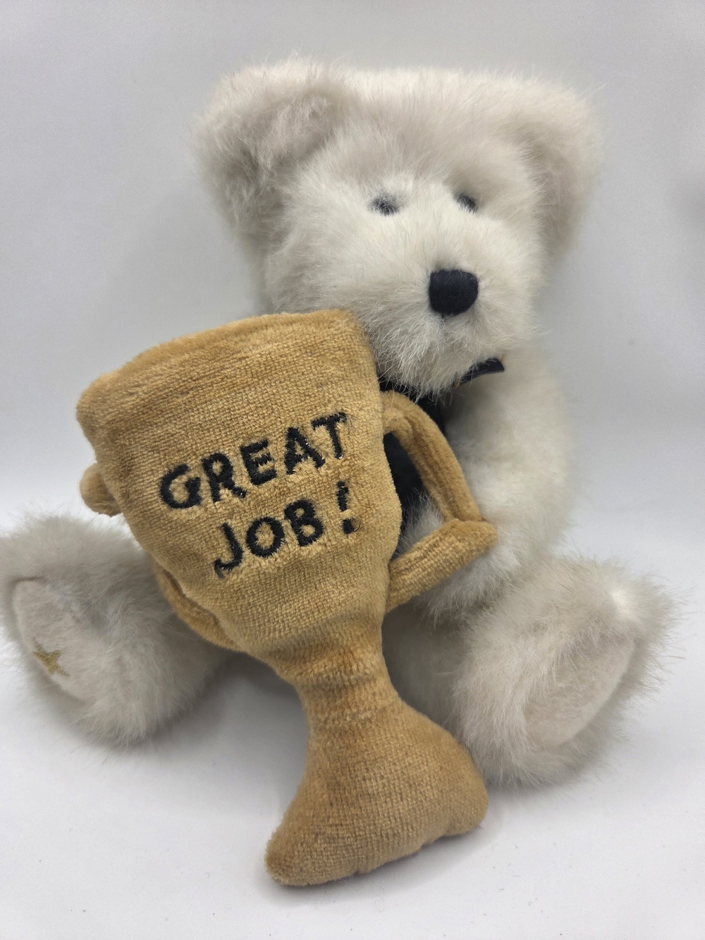 Boyd's Plush white teddy bear holding a gold-colored Great Job trophy